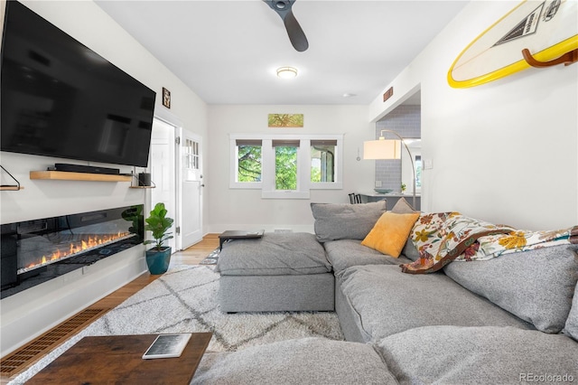 4501 Zenobia St, Denver, CO 80212 - living room with a ceiling fan, wood finished floors, and a glass covered fireplace