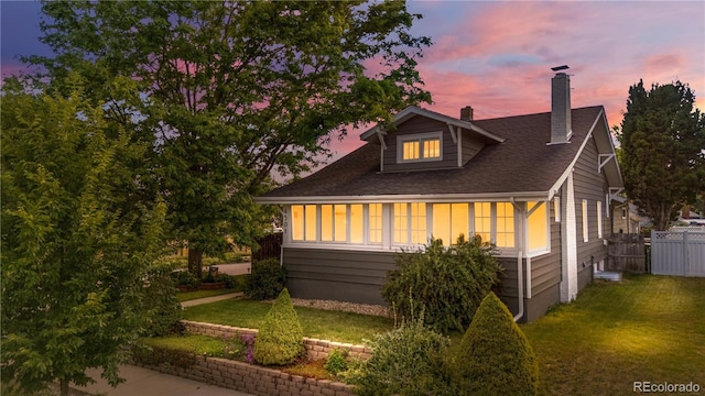 4501 Zenobia St, Denver, CO 80212 - view of front of home featuring a chimney and a shingled roof