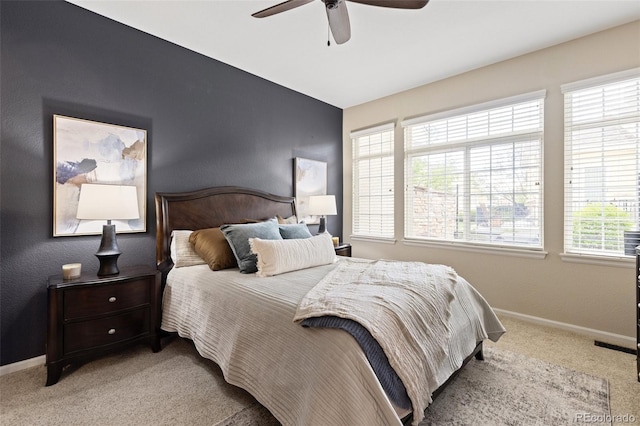 bedroom with carpet, baseboards, and ceiling fan