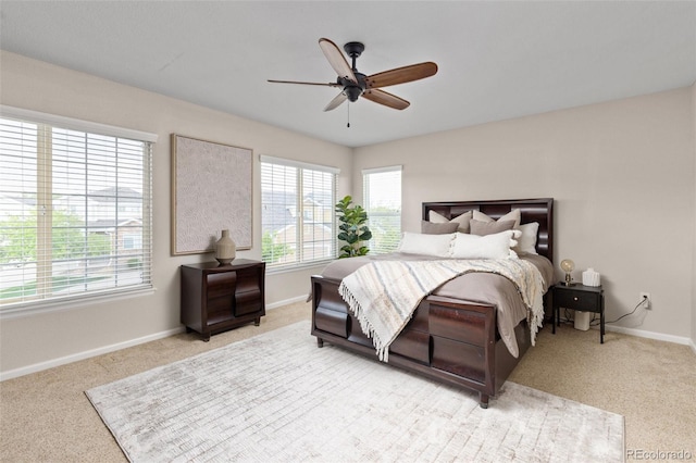 bedroom with carpet floors, baseboards, and ceiling fan
