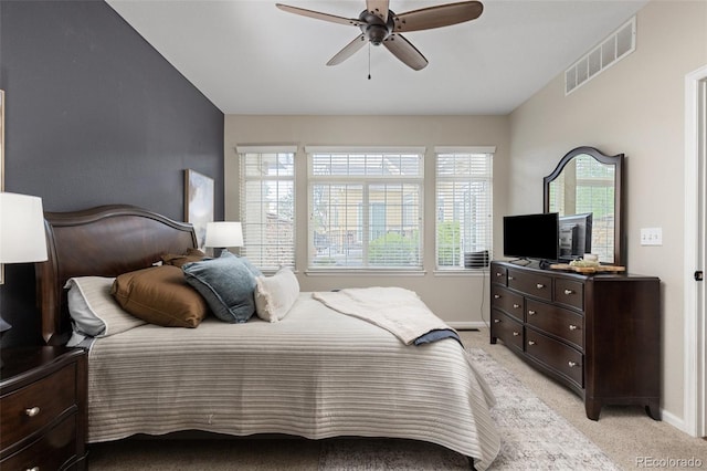 bedroom with light carpet, baseboards, and ceiling fan