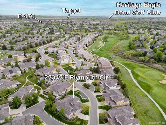 aerial overview of property's location with nearby suburban area and a local golf course