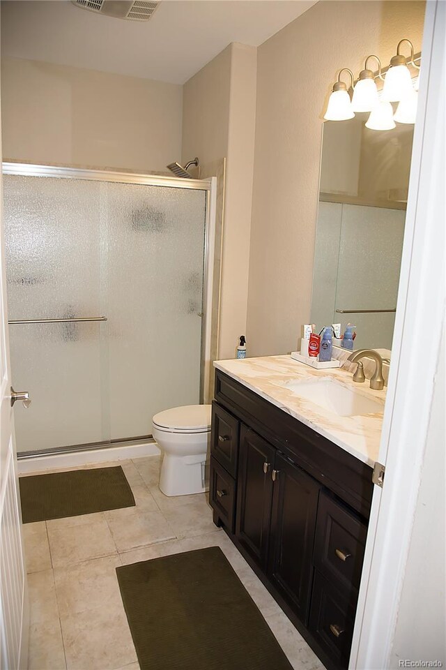 3910 Mighty Oaks St, Castle Rock, CO 80104 - full bath with a shower stall, toilet, vanity, and tile patterned floors