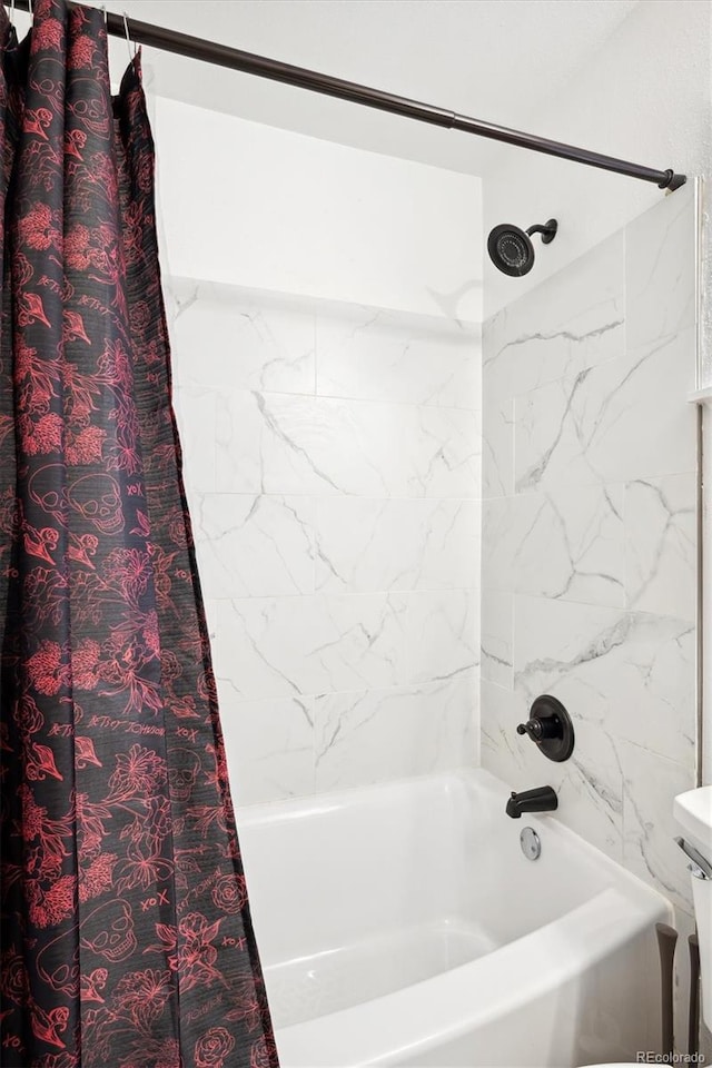 2277 S Buckley Rd Unit 102, Aurora, CO 80013 - bathroom featuring shower / bath combo with shower curtain