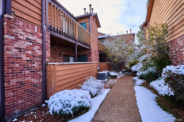 2277 S Buckley Rd Unit 102, Aurora, CO 80013 - snowy yard with a balcony and central AC