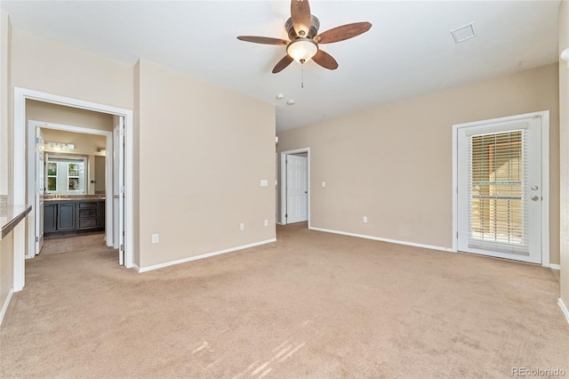 9637 E 5th Ave Unit 101, Denver, CO 80230 - spare room featuring light colored carpet and ceiling fan
