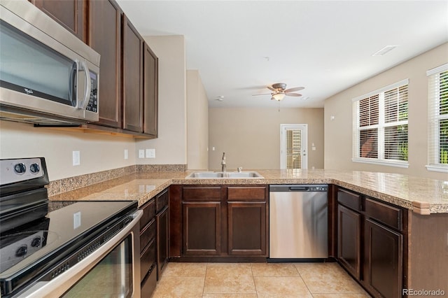 9637 E 5th Ave Unit 101, Denver, CO 80230 - kitchen featuring stainless steel appliances, a ceiling fan, and dark brown cabinets