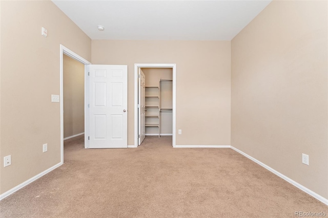 9637 E 5th Ave Unit 101, Denver, CO 80230 - unfurnished bedroom with carpet floors, a walk in closet, and a closet