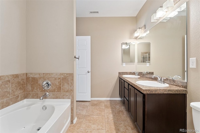 9637 E 5th Ave Unit 101, Denver, CO 80230 - full bathroom with a bath, double vanity, and tile patterned flooring