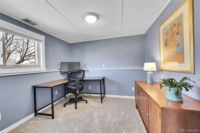 office area with visible vents, baseboards, and carpet