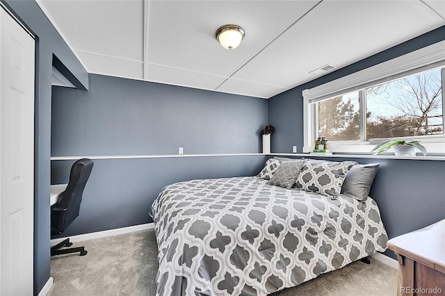 carpeted bedroom featuring baseboards and visible vents