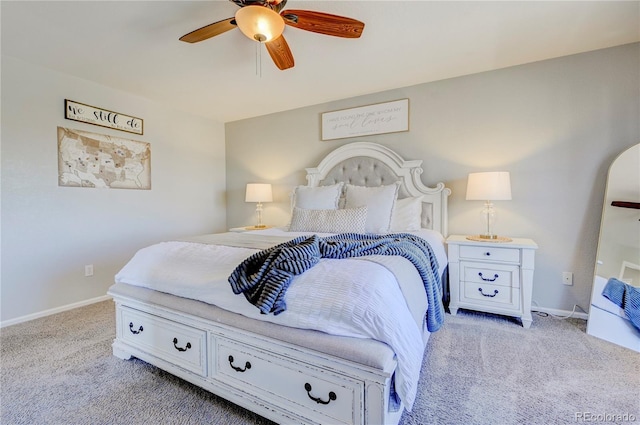 bedroom with carpet flooring, baseboards, and a ceiling fan