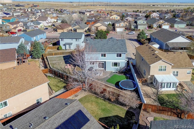 birds eye view of property with a residential view