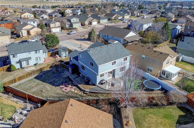 birds eye view of property with a residential view