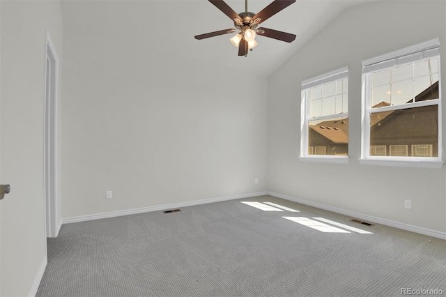 unfurnished room featuring carpet, baseboards, a ceiling fan, and lofted ceiling