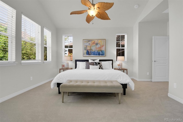 bedroom featuring light colored carpet, baseboards, and a ceiling fan