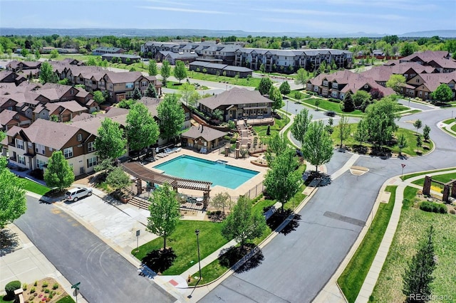 aerial perspective of suburban area featuring a pool area