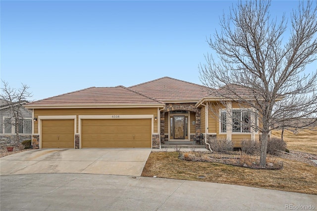 view of front of property with a garage