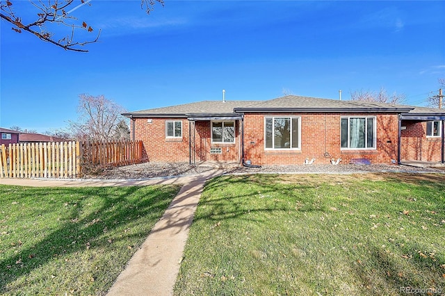 rear view of house with a lawn