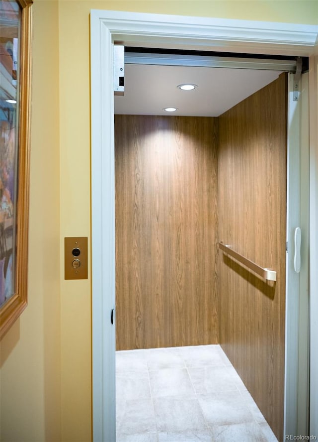 room details featuring elevator and recessed lighting