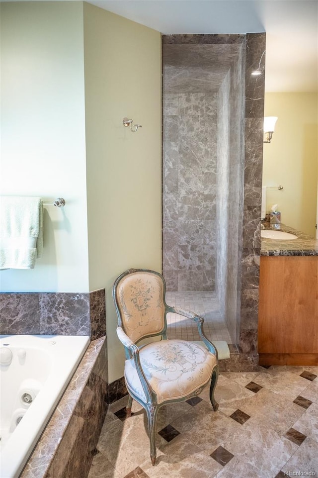 bathroom with a relaxing tiled tub and vanity