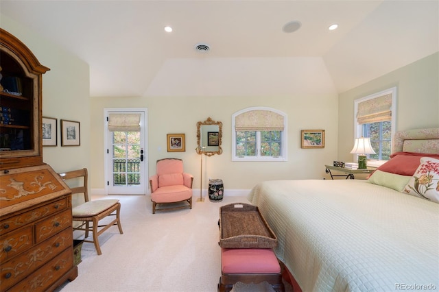 bedroom featuring access to exterior, light colored carpet, visible vents, and multiple windows