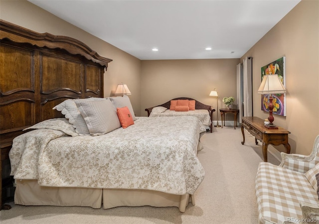 bedroom with light carpet and recessed lighting