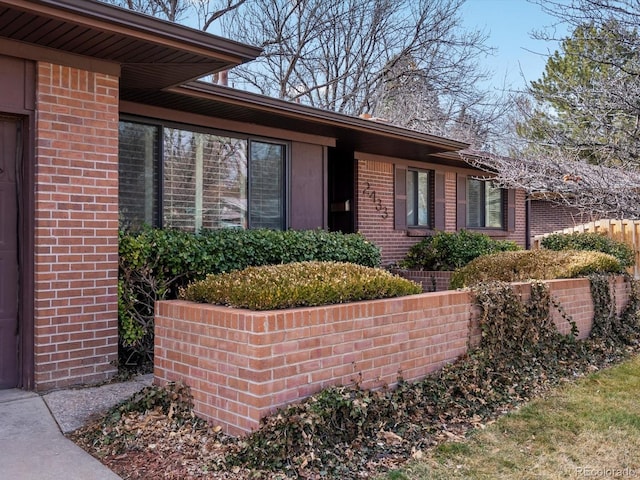 exterior space with brick siding