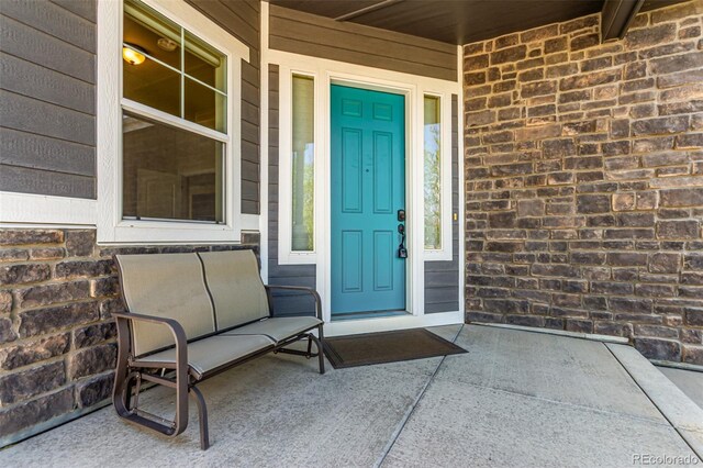property entrance with covered porch