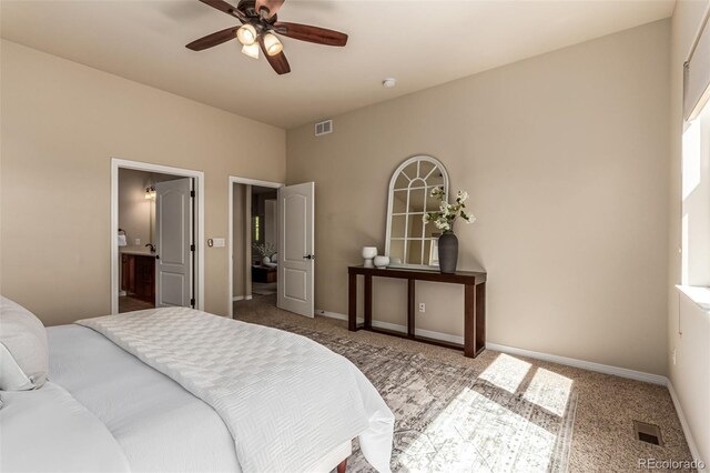bedroom featuring carpet floors, baseboards, ensuite bath, and visible vents
