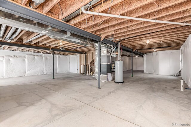 unfinished basement with heating unit and gas water heater