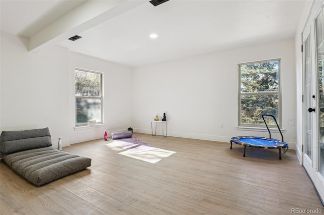 unfurnished room featuring light wood-style flooring, recessed lighting, visible vents, and a wealth of natural light