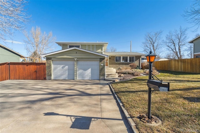 view of front facade featuring a garage and a front yard