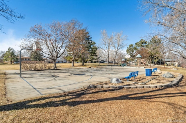 view of yard featuring basketball court and a playground