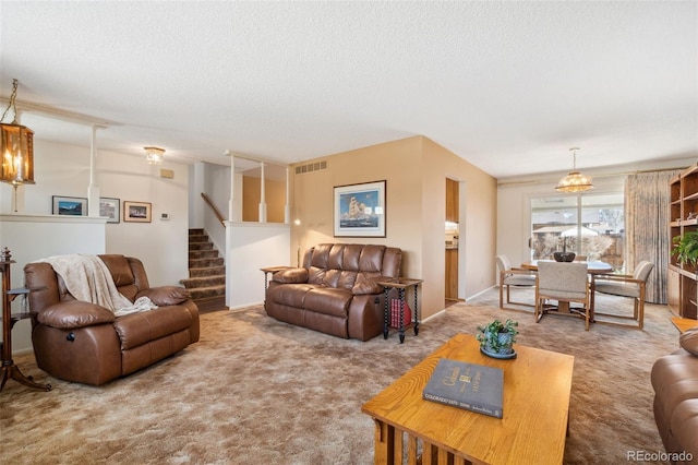 living room featuring carpet flooring and a textured ceiling