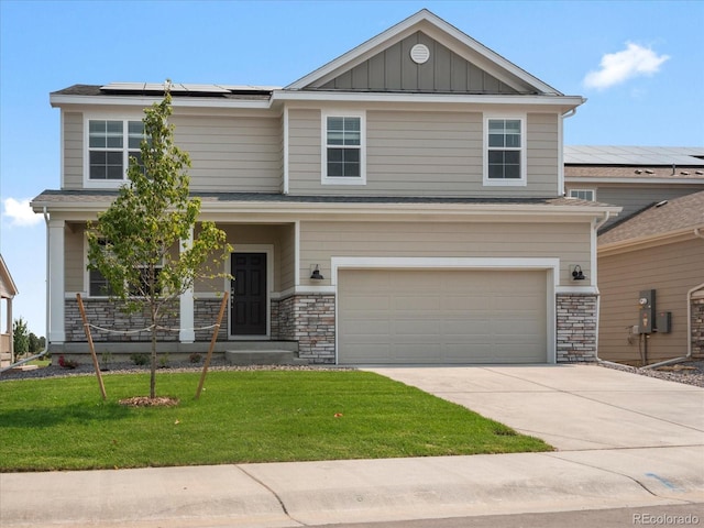 craftsman-style home featuring a front yard, solar panels, and a garage