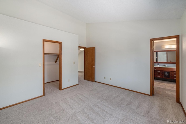 8753 W Cornell Ave Unit 12-1, Denver, CO 80227 - unfurnished bedroom featuring carpet floors, a walk in closet, and a closet
