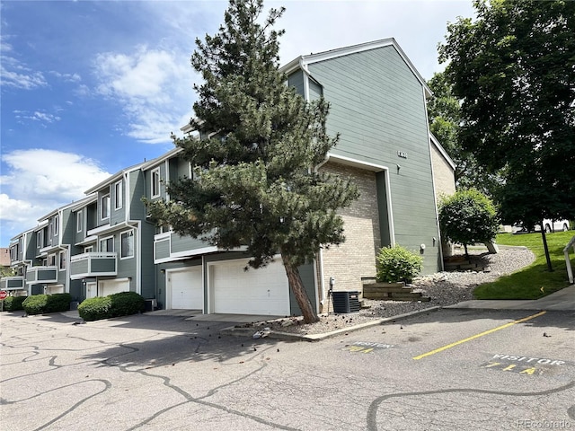 8753 W Cornell Ave Unit 12-1, Denver, CO 80227 - view of property featuring uncovered parking