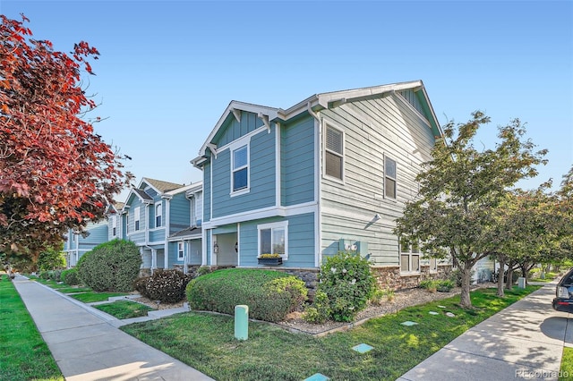 5843 Ceylon St, Denver, CO 80249 - view of front of home with board and batten siding and stone siding