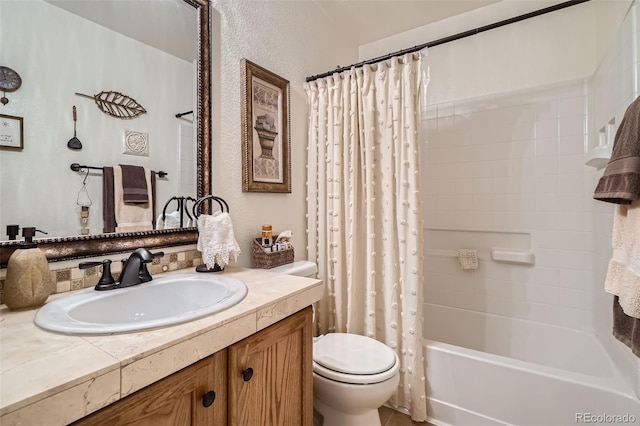 5843 Ceylon St, Denver, CO 80249 - bathroom with toilet, vanity, shower / bath combination with curtain, and a textured wall