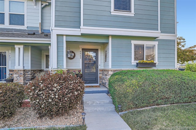 5843 Ceylon St, Denver, CO 80249 - property entrance featuring stone siding