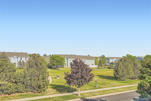 5843 Ceylon St, Denver, CO 80249 - view of property's community featuring a yard and a residential view