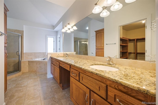 bathroom featuring tile patterned flooring, vanity, lofted ceiling, and independent shower and bath