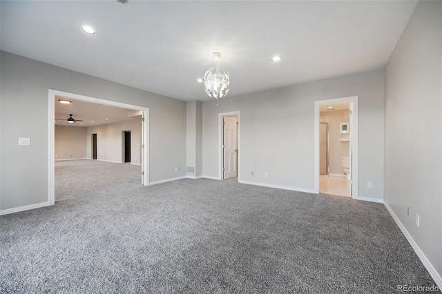 spare room with carpet flooring and ceiling fan with notable chandelier