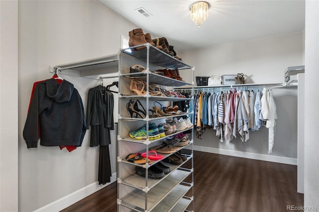 walk in closet featuring wood finished floors and visible vents
