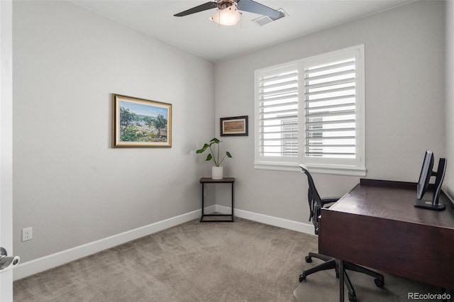 home office featuring carpet floors, baseboards, a ceiling fan, and visible vents