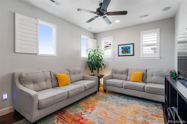 living room with recessed lighting, wood finished floors, visible vents, and a ceiling fan