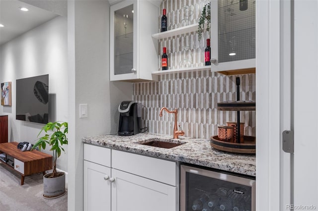 bar featuring a sink, carpet floors, wet bar, wine cooler, and recessed lighting