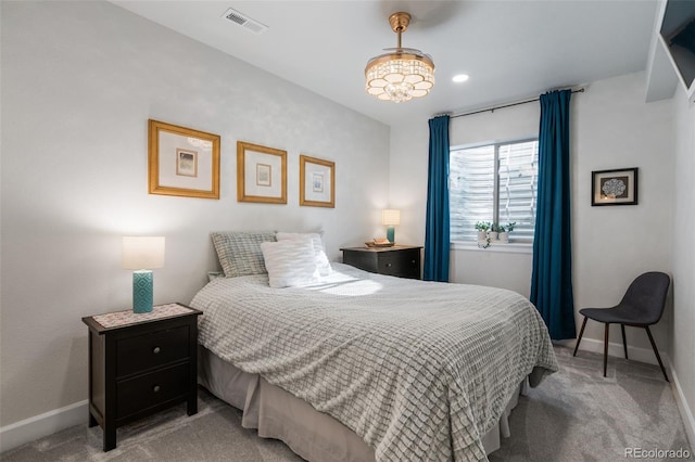 bedroom featuring baseboards, visible vents, and carpet floors
