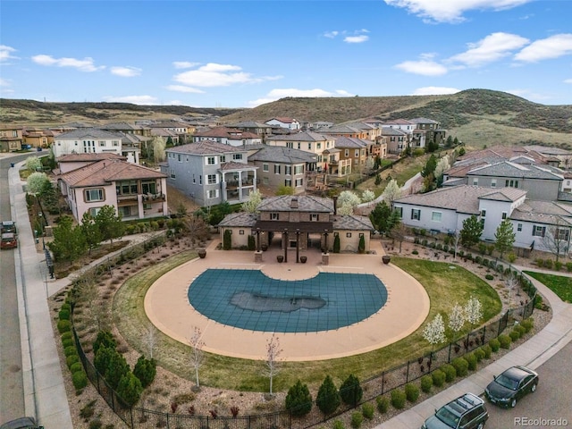 view of swimming pool with a mountain view and a residential view